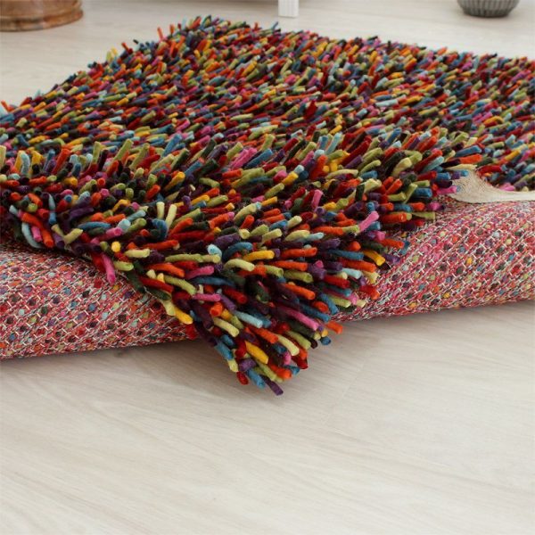 genie woolen felted rug folded on the floor 04214.1593775925